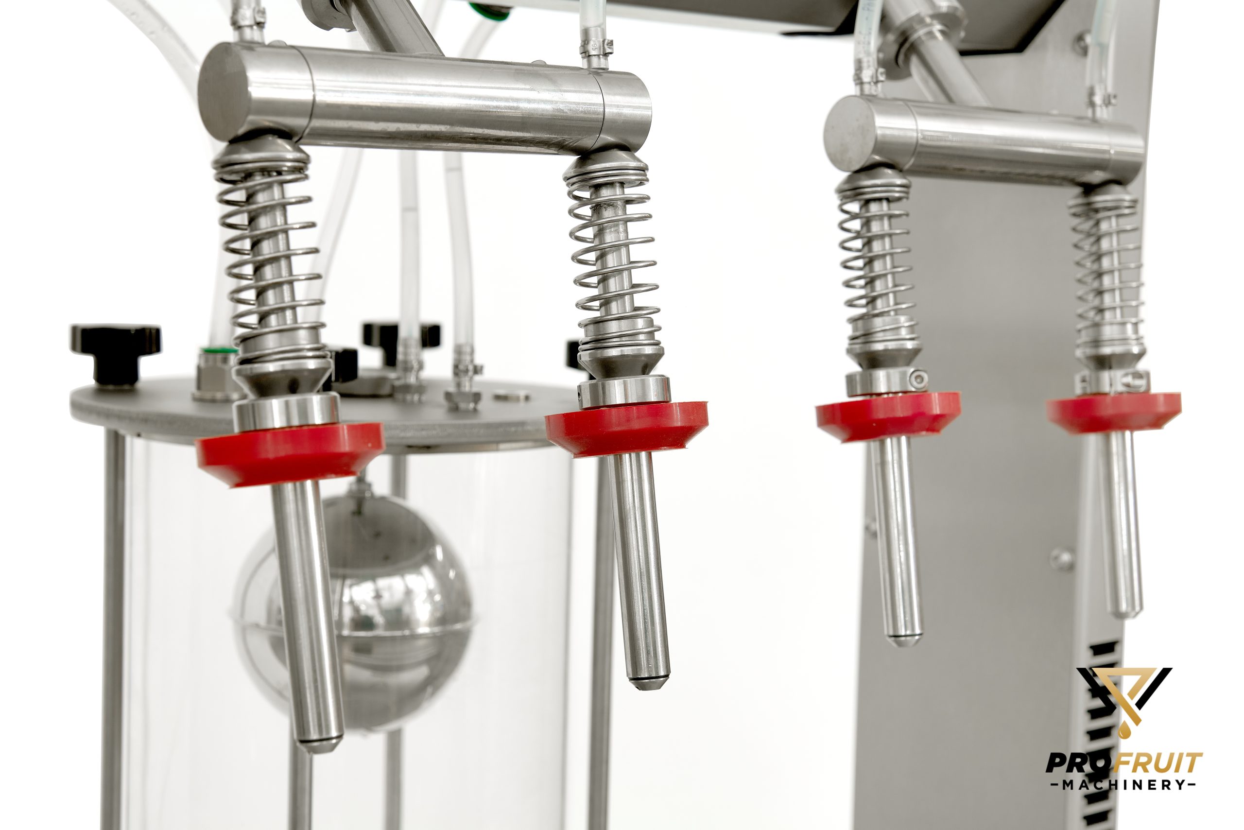 Vacuum bottle filler from up close | ProFruit Machinery